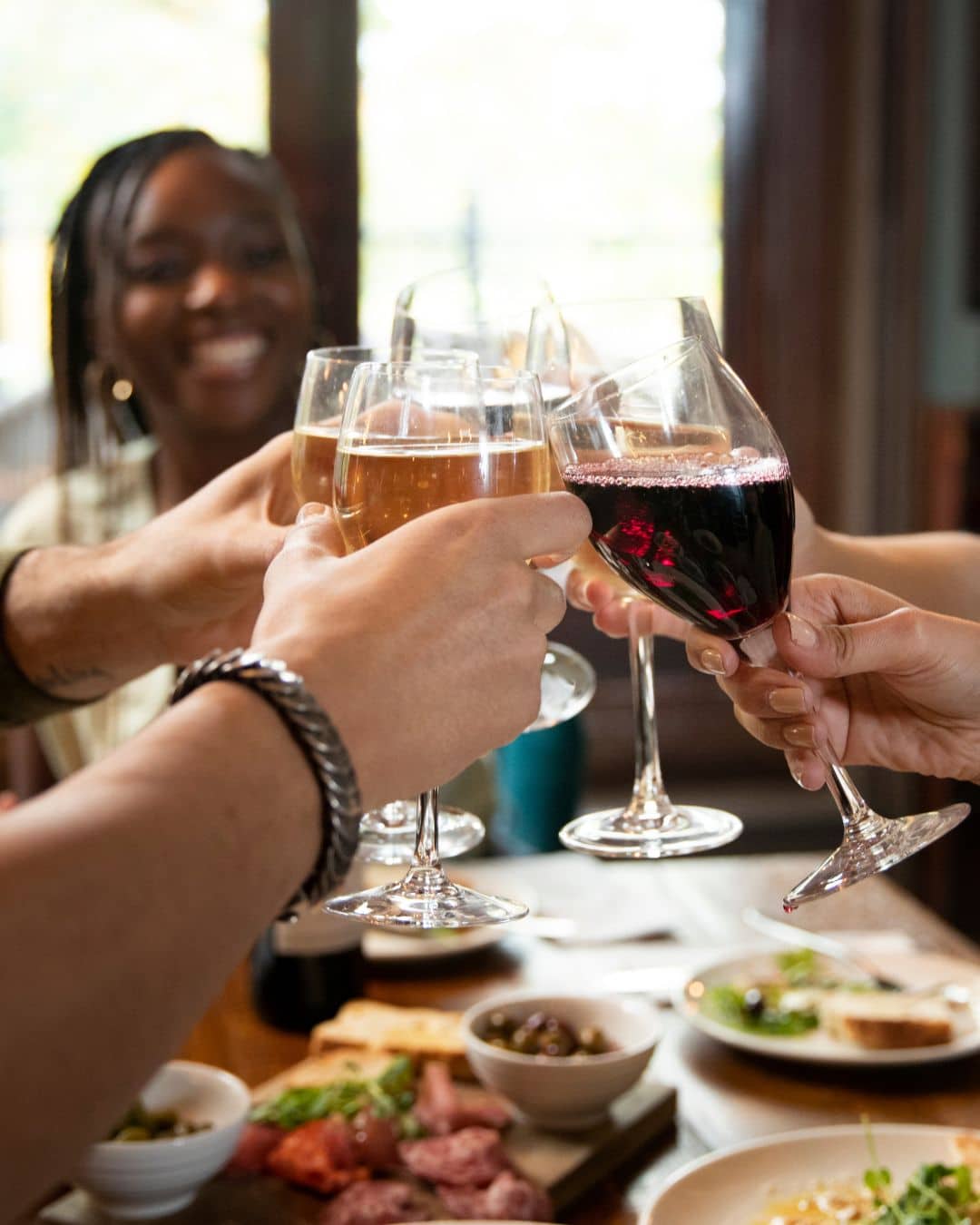 cheers with wine glasses 